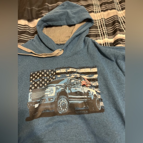 This is a size large, Lincoln Outfitters blue truck and flag hoodie - Picture 1 of 4